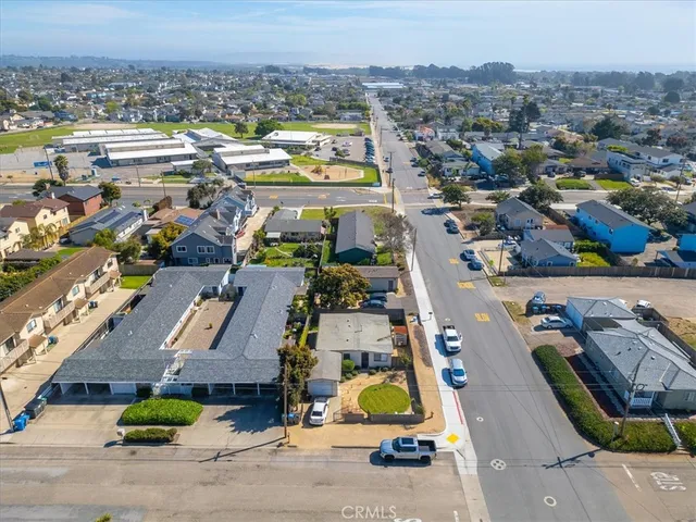 an aerial view of a city with ocean view