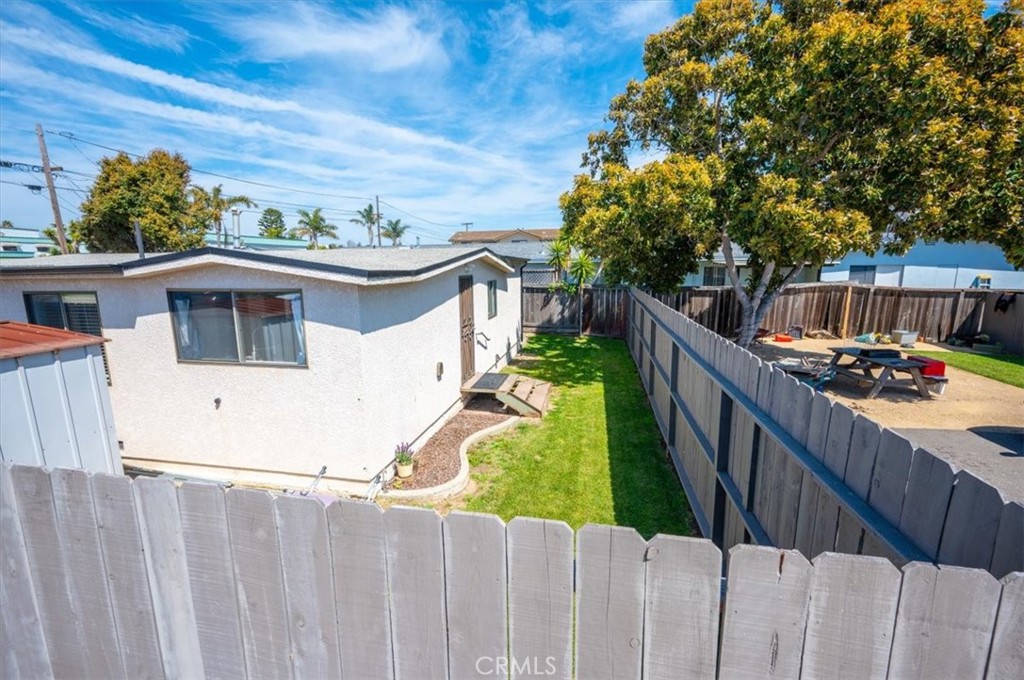 241 South 10th Street Grover Beach, CA 93433 - Photo 9 of 21 a view of a house with wooden fence