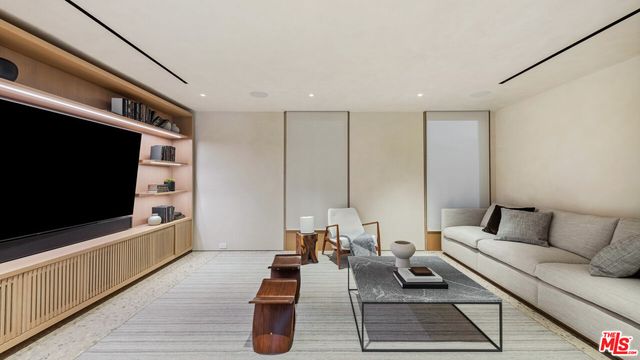 a living room with furniture and a table