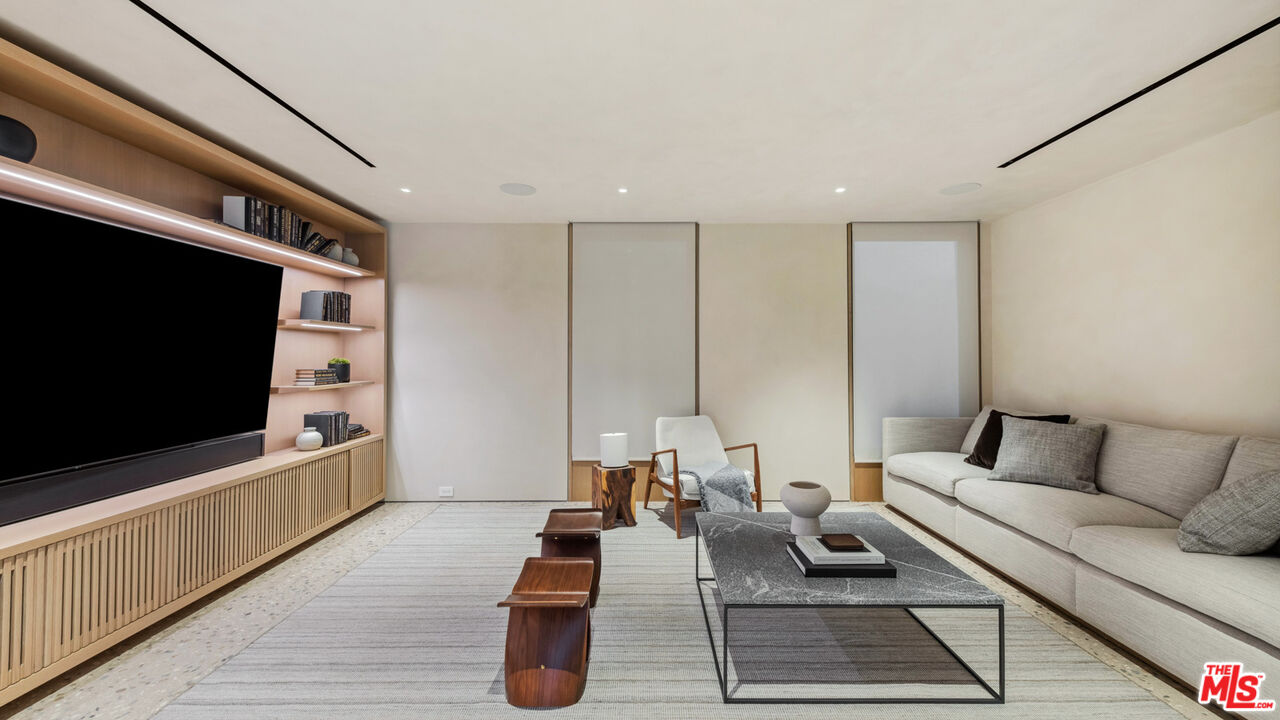 31388 Broad Beach Road Malibu, CA 90265 - Photo 42 of 74 a living room with furniture and a flat screen tv