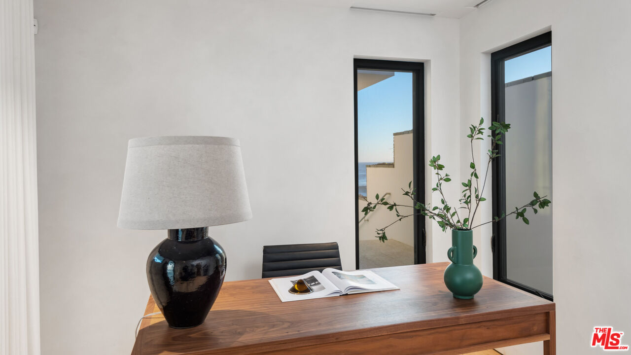 31388 Broad Beach Road Malibu, CA 90265 - Photo 57 of 74 a living room with furniture and a table