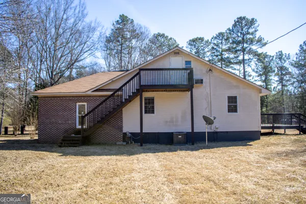 a house view with a wooden fence