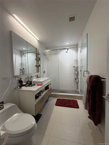 a living room with furniture gym equipment and a fireplace