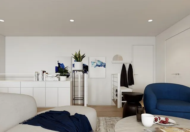 a bedroom with furniture and a potted plant