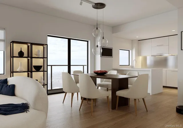 a view of a dining room with furniture window and wooden floor