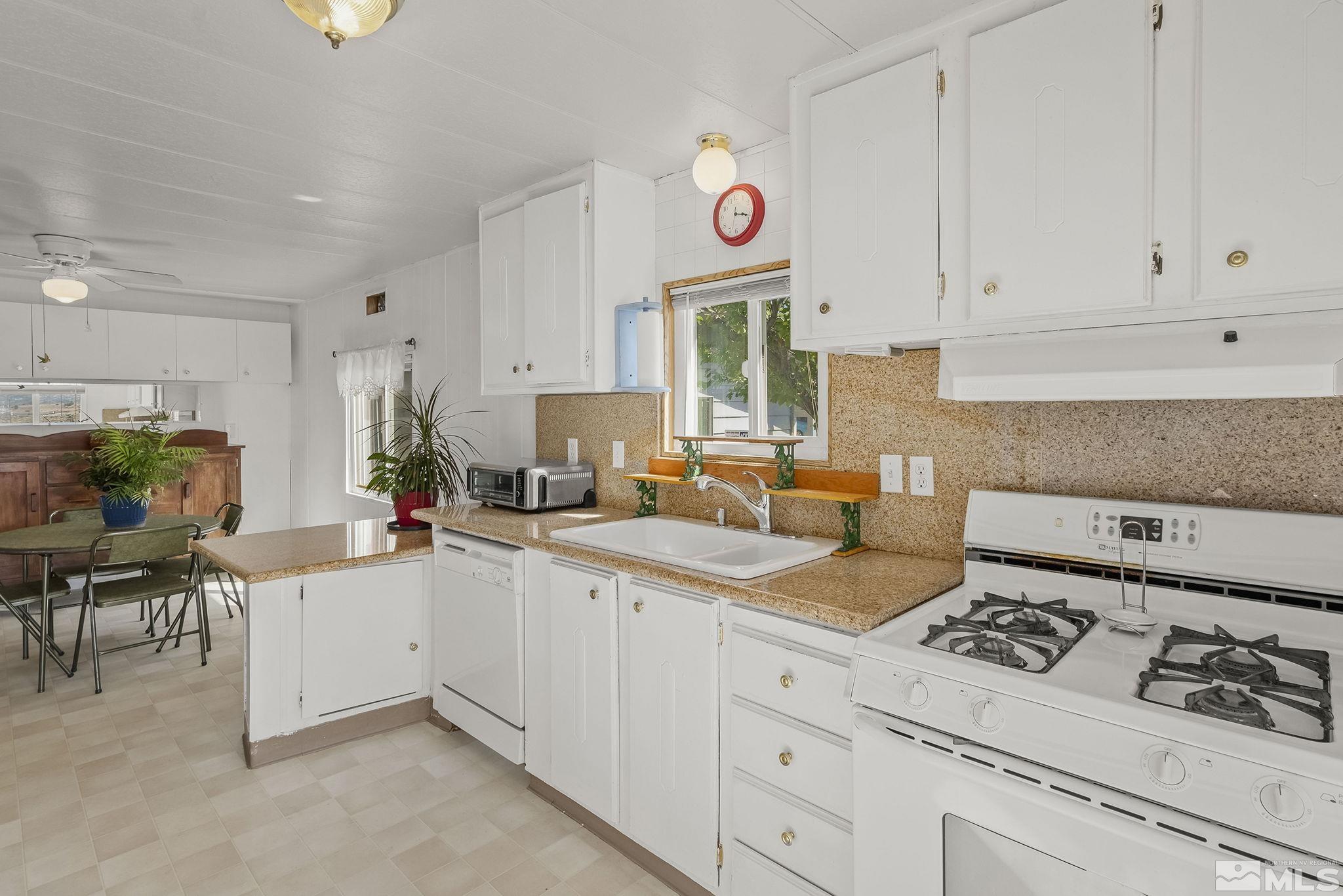 500 Mira Street Reno, NV 89521 - Photo 14 of 31 a kitchen with cabinets and window