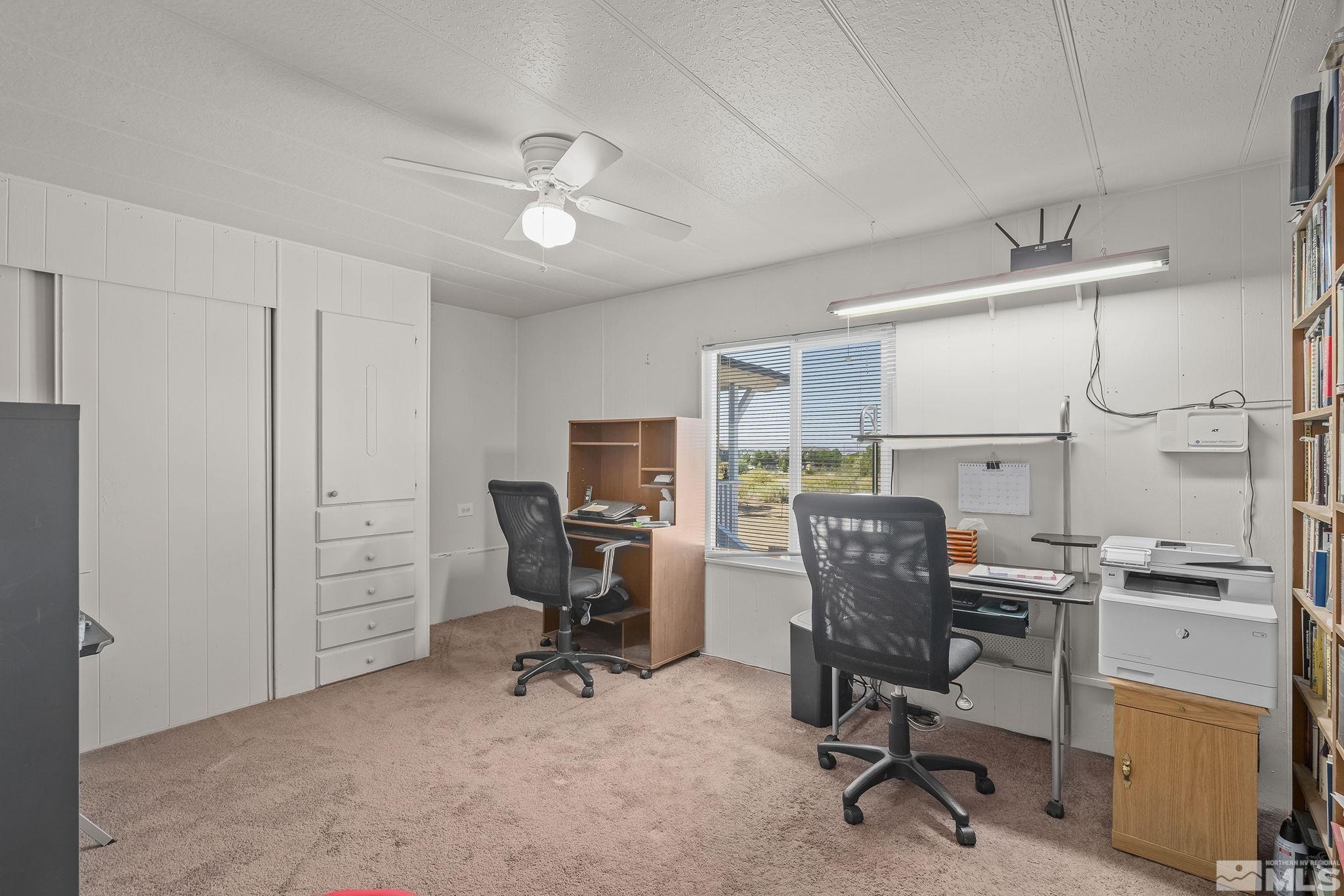 500 Mira Street Reno, NV 89521 - Photo 19 of 31 a view of a workspace with furniture and a window