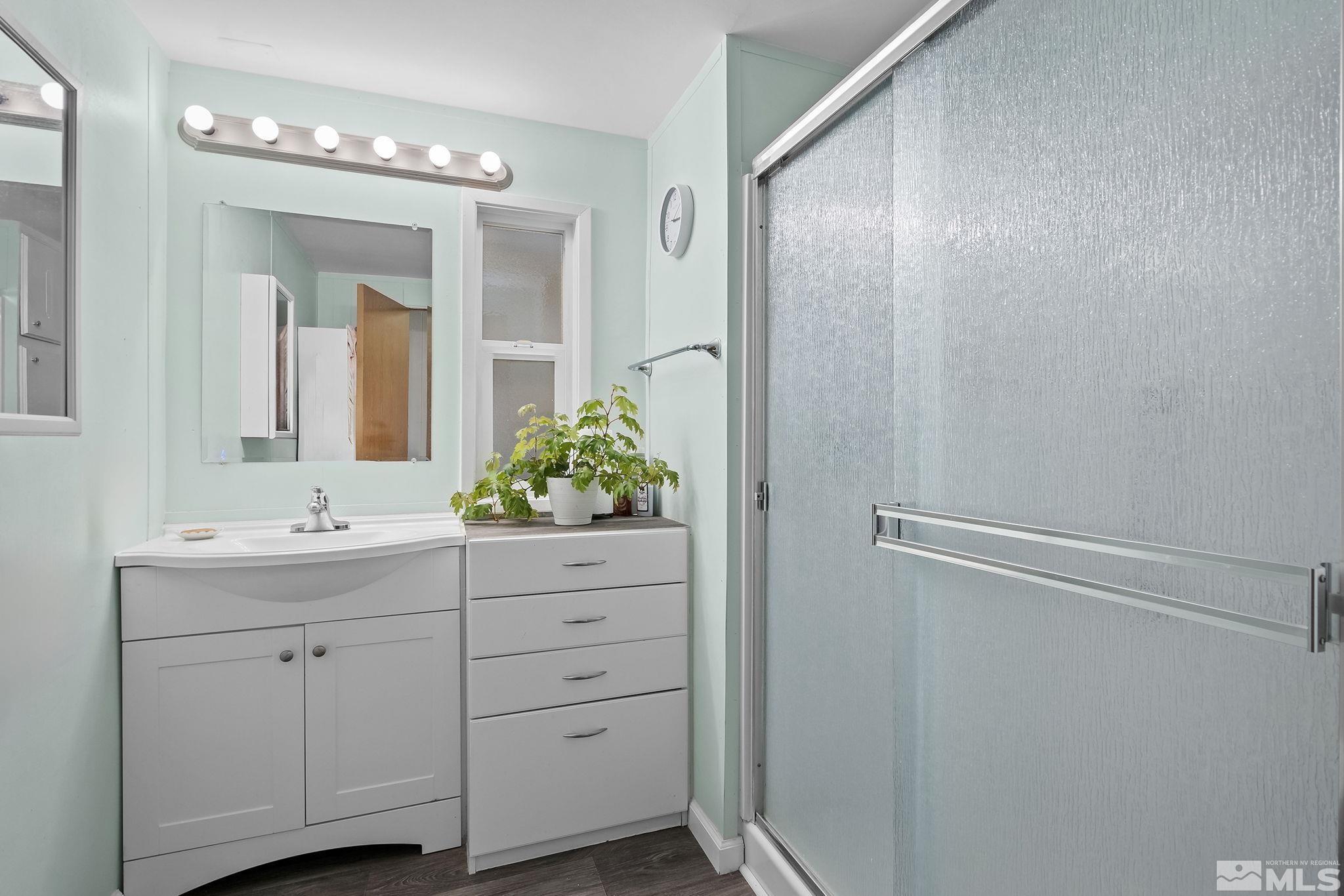 500 Mira Street Reno, NV 89521 - Photo 20 of 31 a bathroom with a granite countertop sink and a mirror