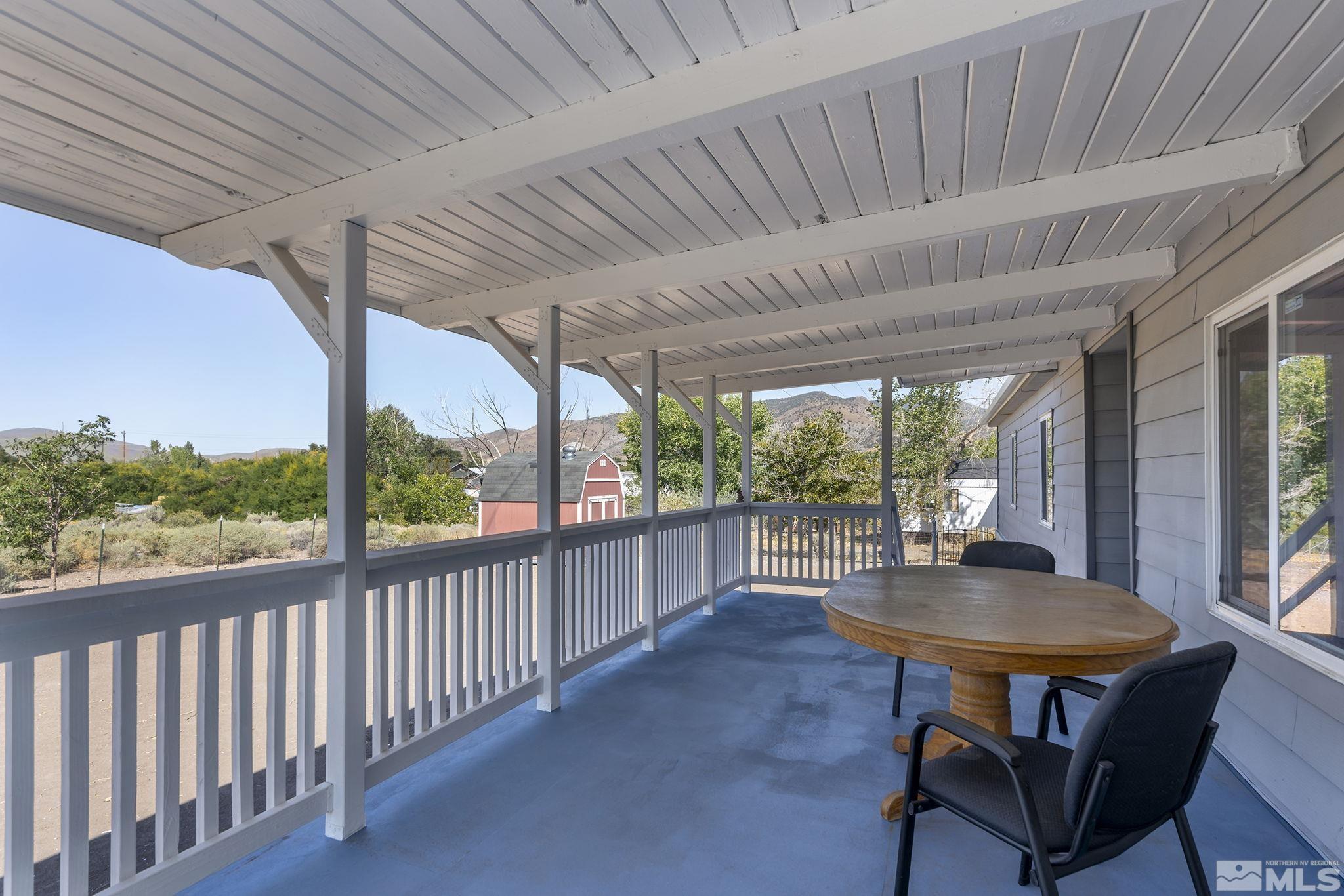 500 Mira Street Reno, NV 89521 - Photo 22 of 31 a view of a patio with a table chairs and a potted plant