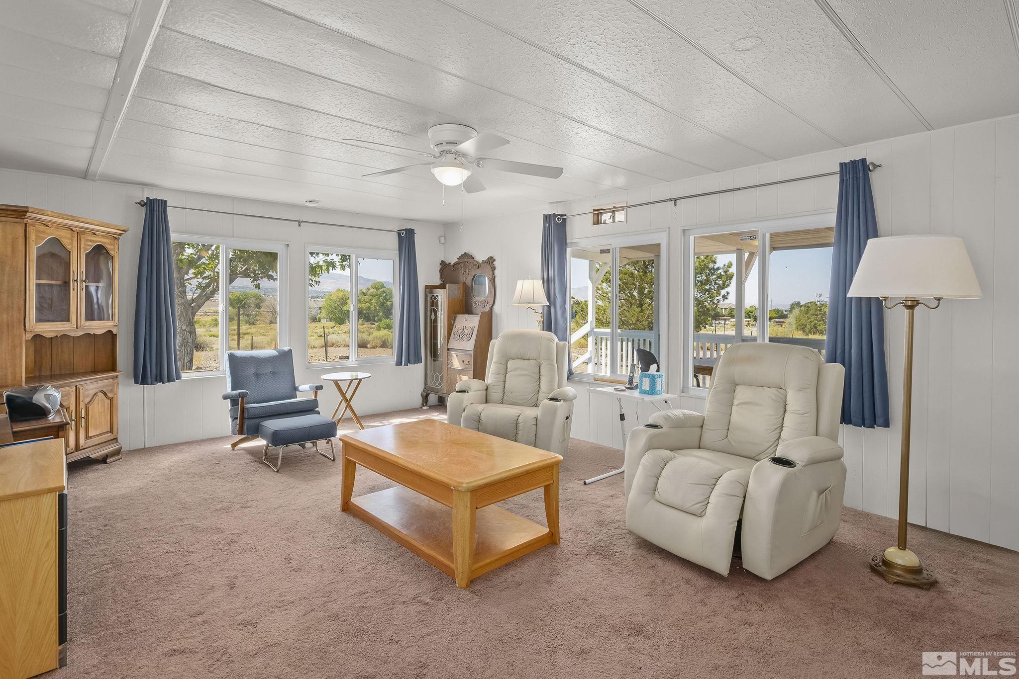 500 Mira Street Reno, NV 89521 - Photo 8 of 31 a living room with furniture and a chandelier