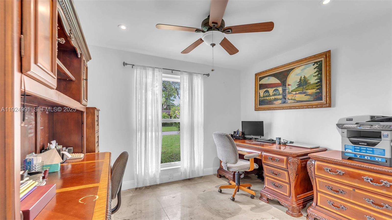 9220 Southwest 94th Place Miami, FL 33176 - Photo 11 of 67 a view of a workspace with furniture and a window