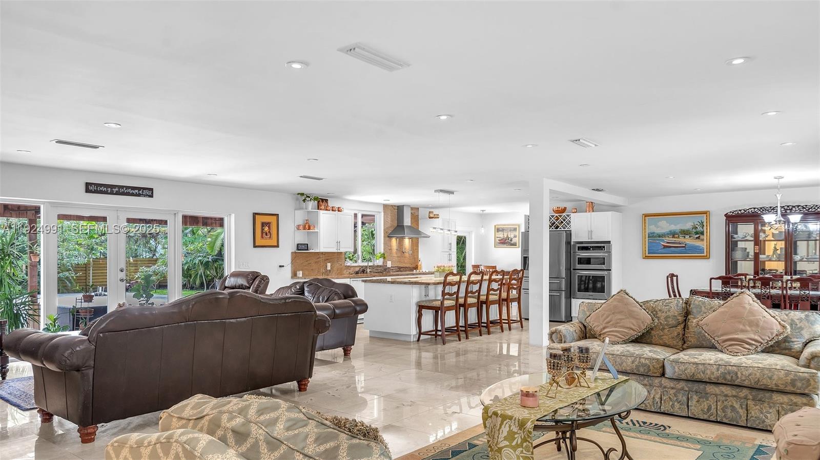9220 Southwest 94th Place Miami, FL 33176 - Photo 18 of 67 a living room with furniture and large windows