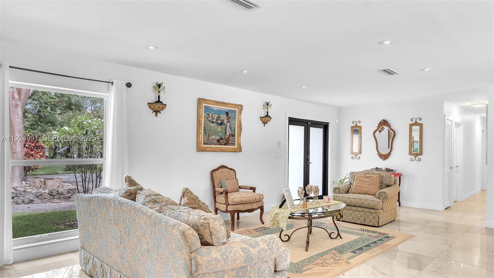 9220 Southwest 94th Place Miami, FL 33176 - Photo 20 of 67 a living room with furniture and a large window