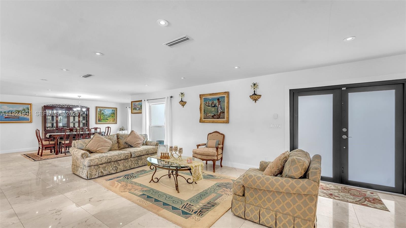 9220 Southwest 94th Place Miami, FL 33176 - Photo 3 of 67 a living room with furniture and a couch