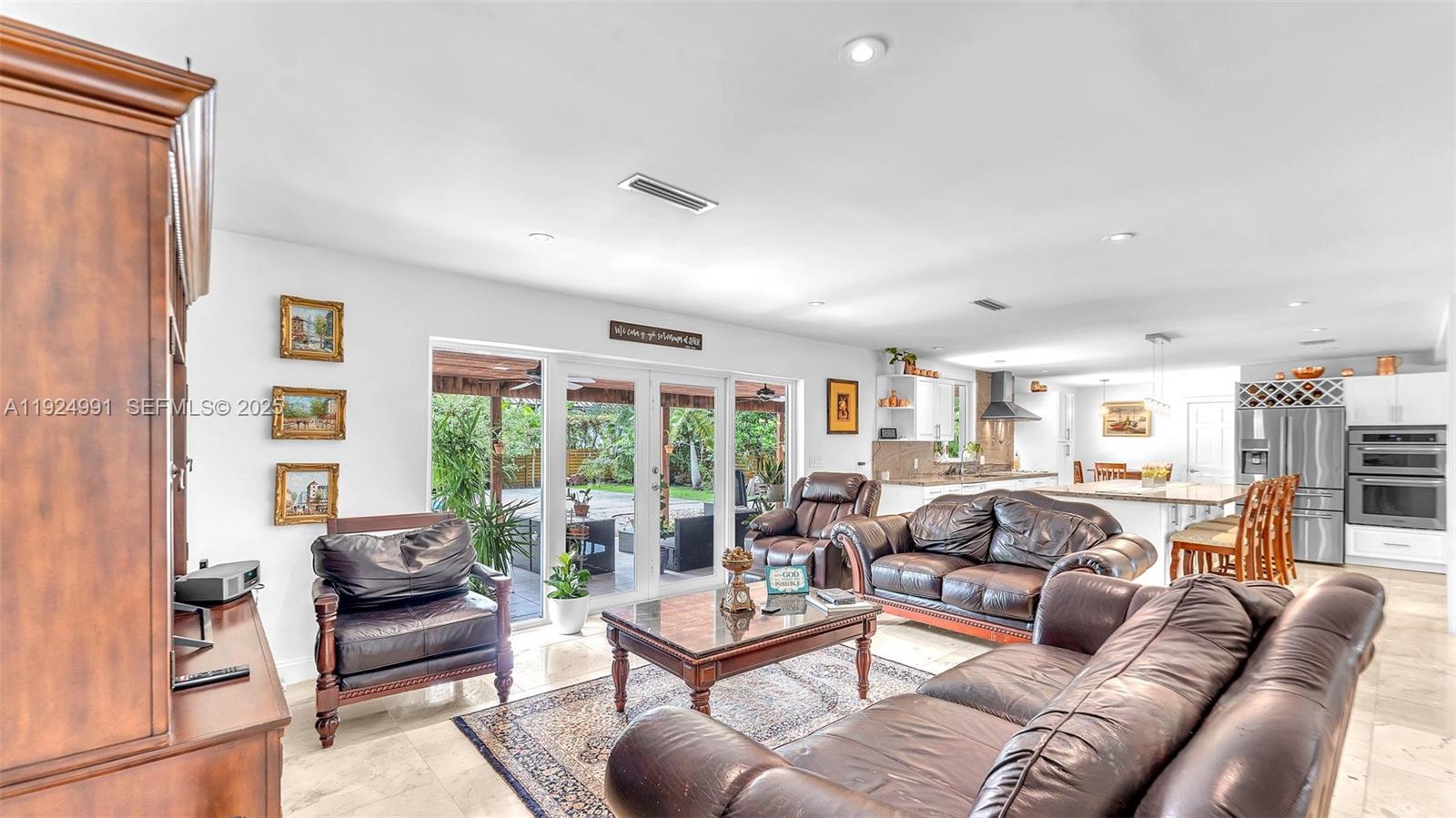 9220 Southwest 94th Place Miami, FL 33176 - Photo 33 of 67 a living room with furniture and a large window
