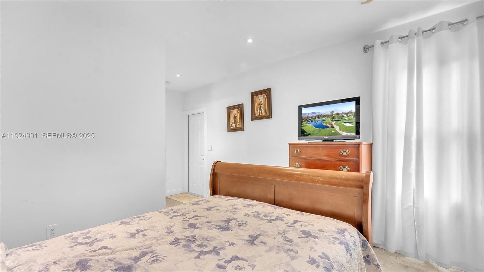 9220 Southwest 94th Place Miami, FL 33176 - Photo 46 of 67 a bedroom with a bed and a window