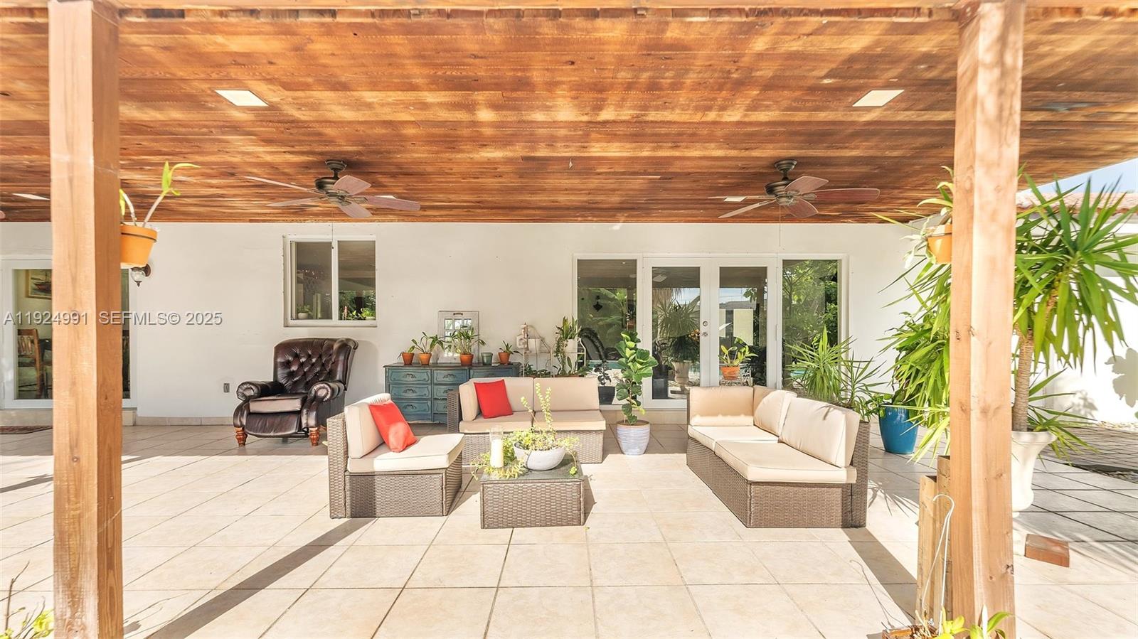 9220 Southwest 94th Place Miami, FL 33176 - Photo 49 of 67 a view of a patio with couches and potted plants