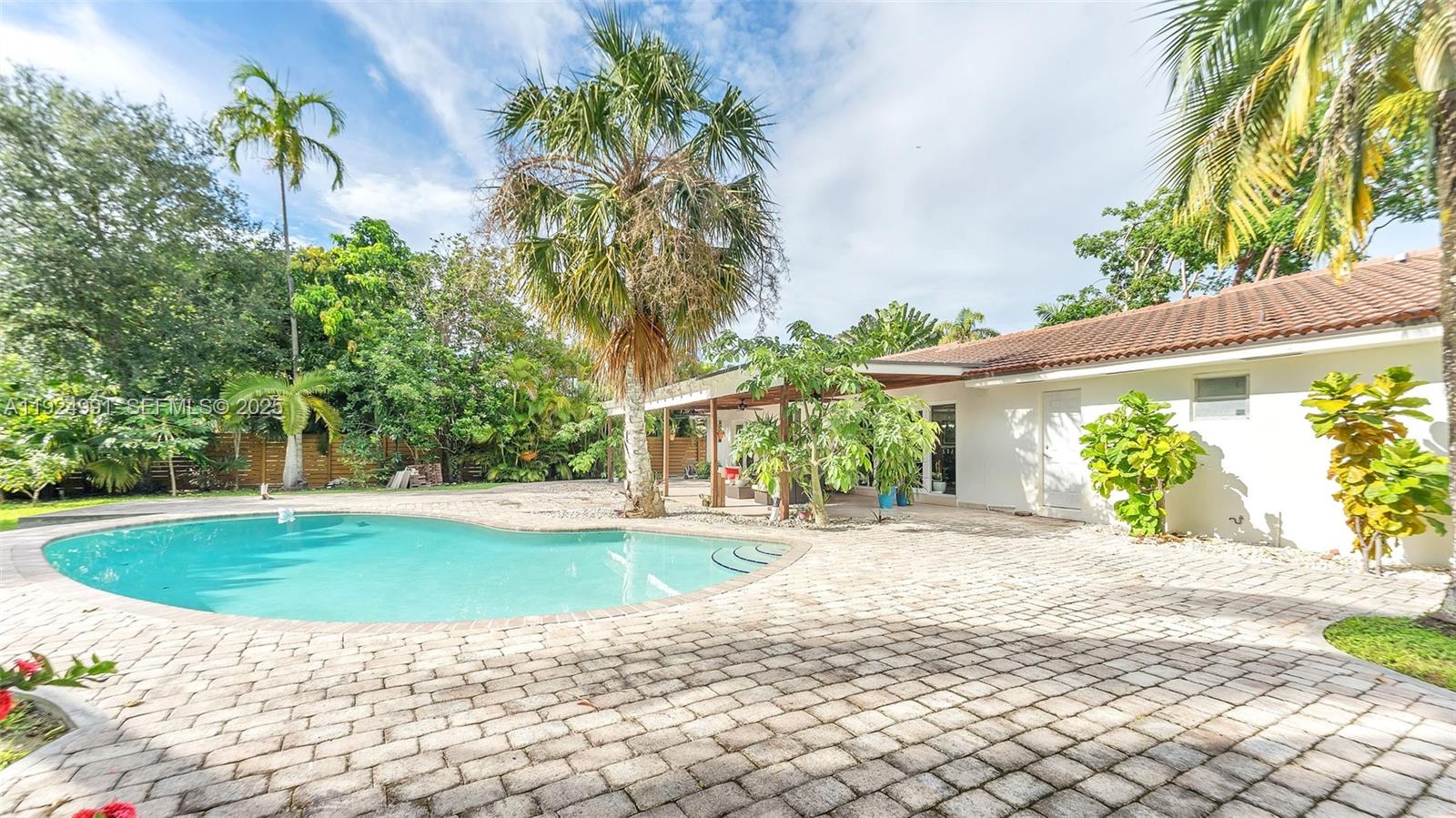9220 Southwest 94th Place Miami, FL 33176 - Photo 53 of 67 a view of a swimming pool with a patio