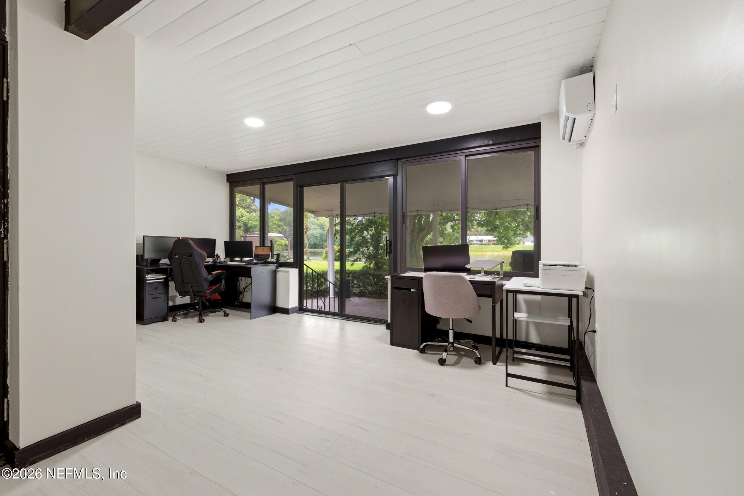 7484 Spinola Road Jacksonville, FL 32217 - Photo 44 of 63 a view of a livingroom with workspace and a window