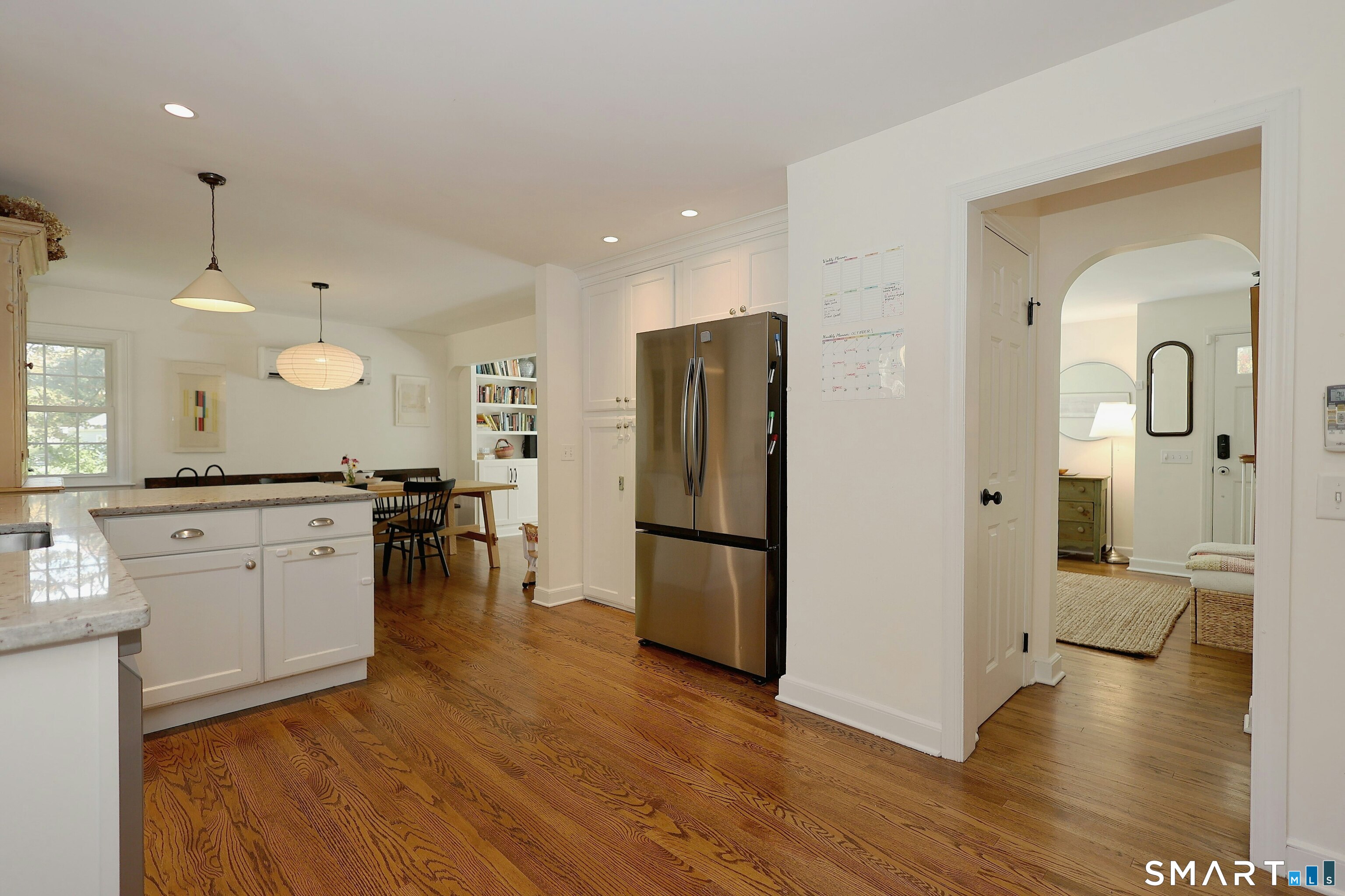 18 Head Of Meadow Road Newtown, CT 06470 - Photo 21 of 40 a large kitchen with a wooden floor and a refrigerator
