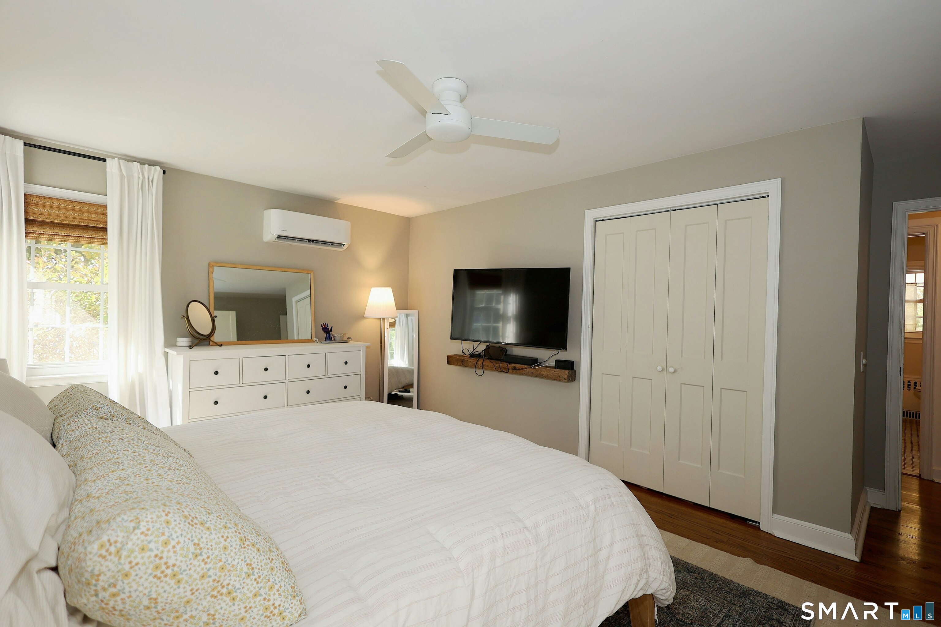 18 Head Of Meadow Road Newtown, CT 06470 - Photo 23 of 40 a bedroom with a bed and a flat screen tv