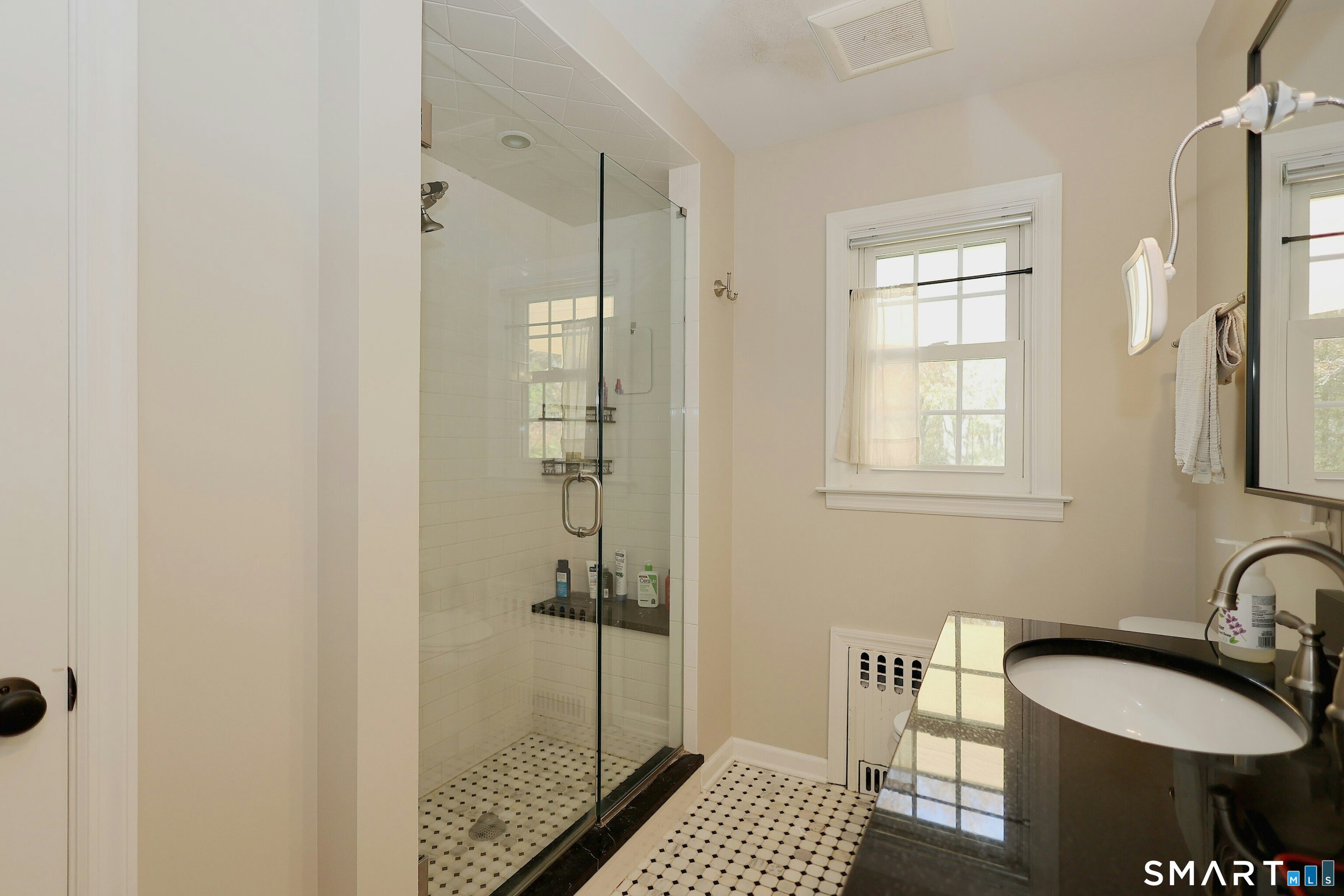 18 Head Of Meadow Road Newtown, CT 06470 - Photo 25 of 40 a bathroom with a sink toilet and shower