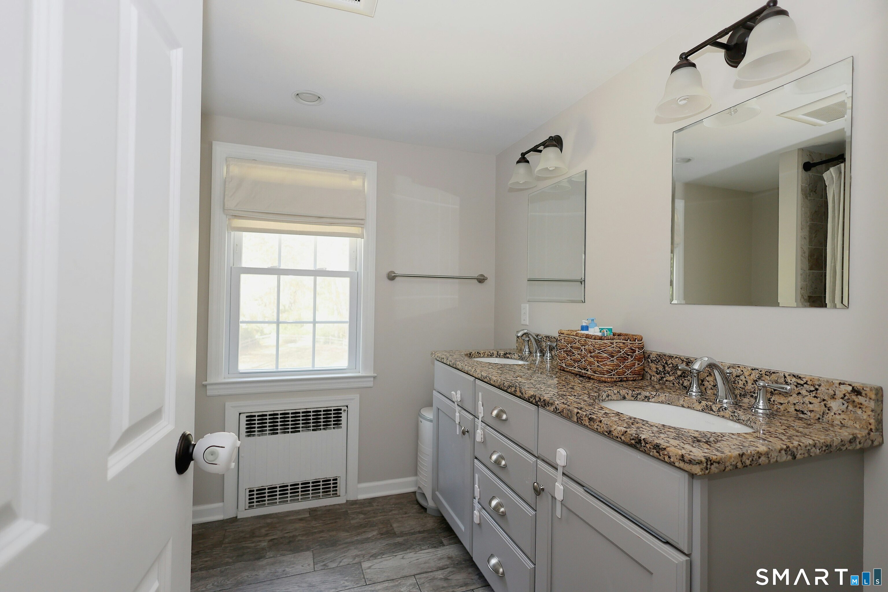 18 Head Of Meadow Road Newtown, CT 06470 - Photo 32 of 40 a bathroom with a granite countertop sink and a mirror