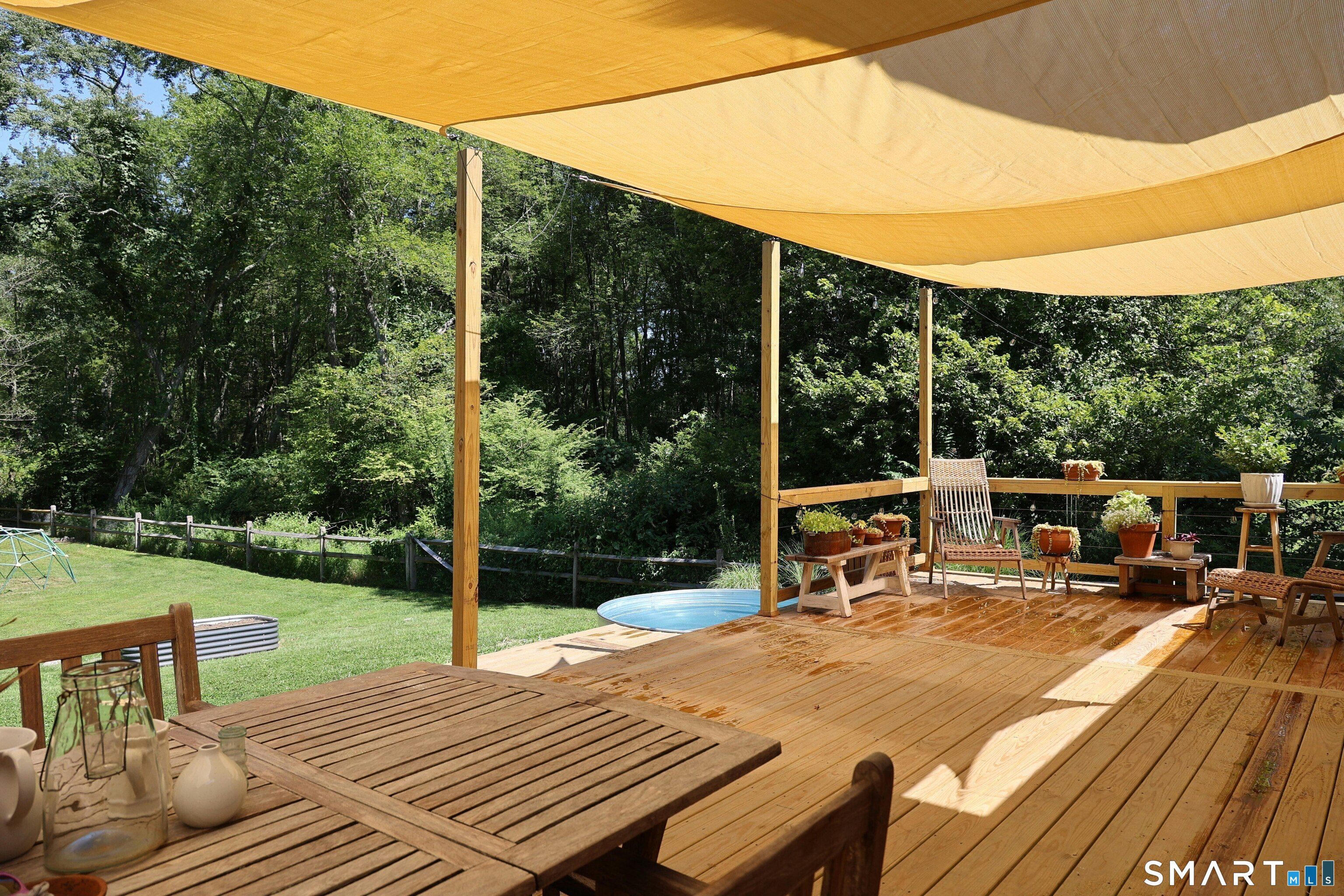 18 Head Of Meadow Road Newtown, CT 06470 - Photo 9 of 40 a view of a patio with a table chairs and a backyard