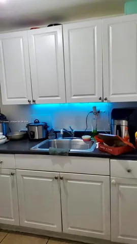a view of a large building with wooden fence