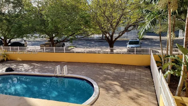 a view of a swimming pool with an outdoor space