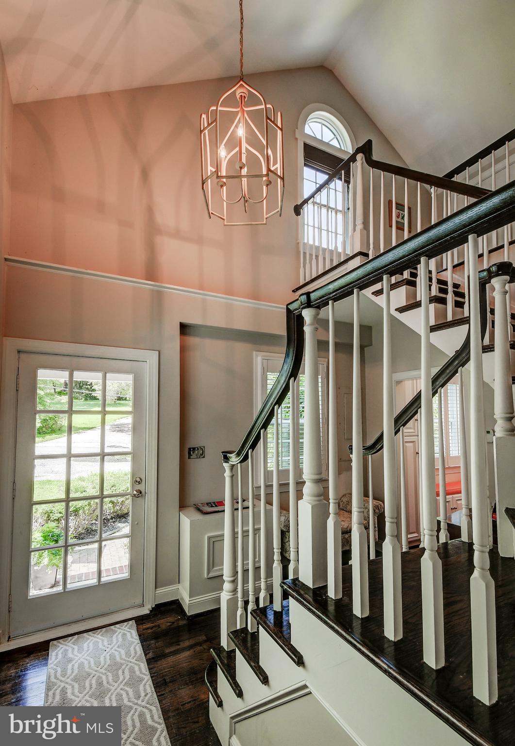 1741 Circle Road Baltimore, MD 21204 - Photo 27 of 40 a view of staircase with lots of frames on wall and a window