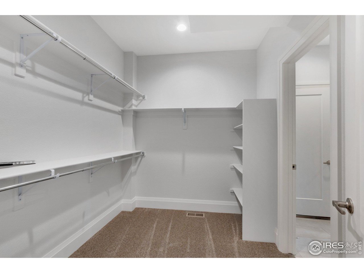 5700 2nd Road Greeley, CO 80634 - Photo 24 of 40 The primary closet isn't lacking for space, and has direct access to the laundry room