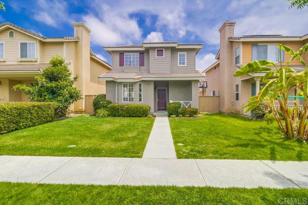 a view of house with a yard