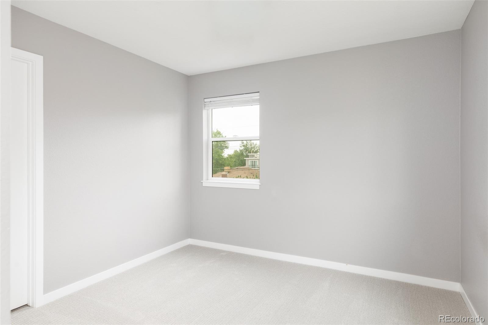 5230 Stuart Street Denver, CO 80212 - Photo 25 of 34 an empty room with a window