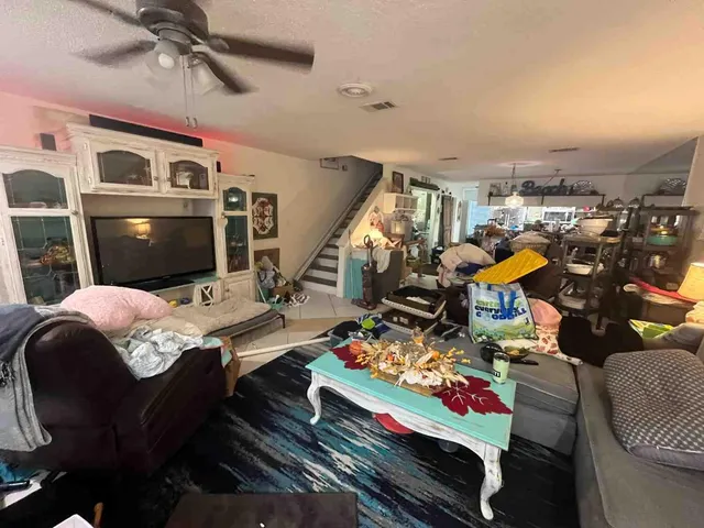 a bed room with furniture and a flat screen tv