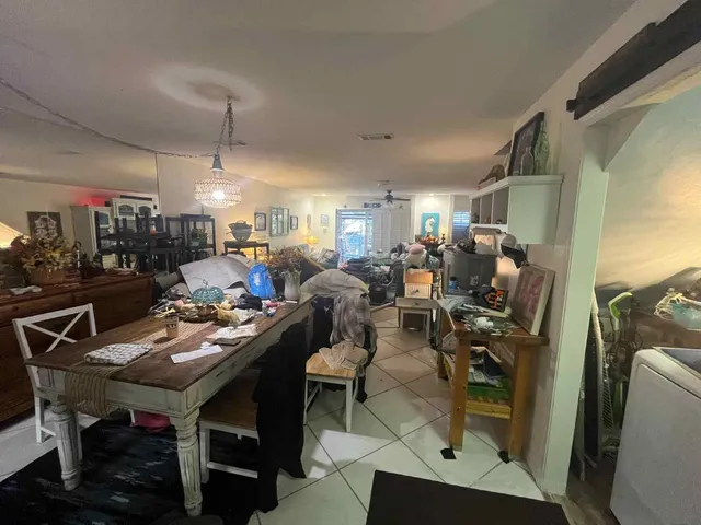 a view of a workspace with furniture and rug