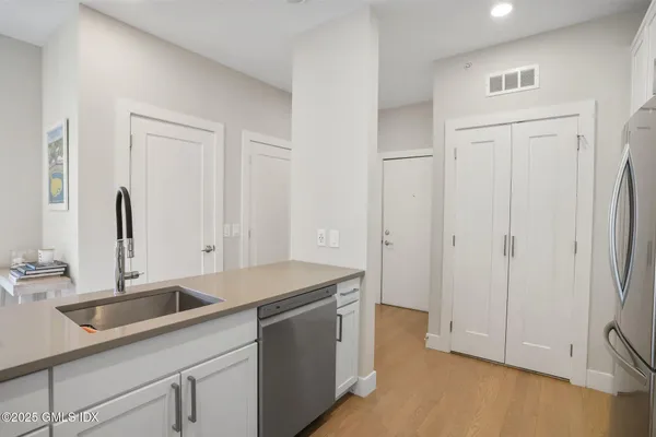 a kitchen with a sink and cabinets
