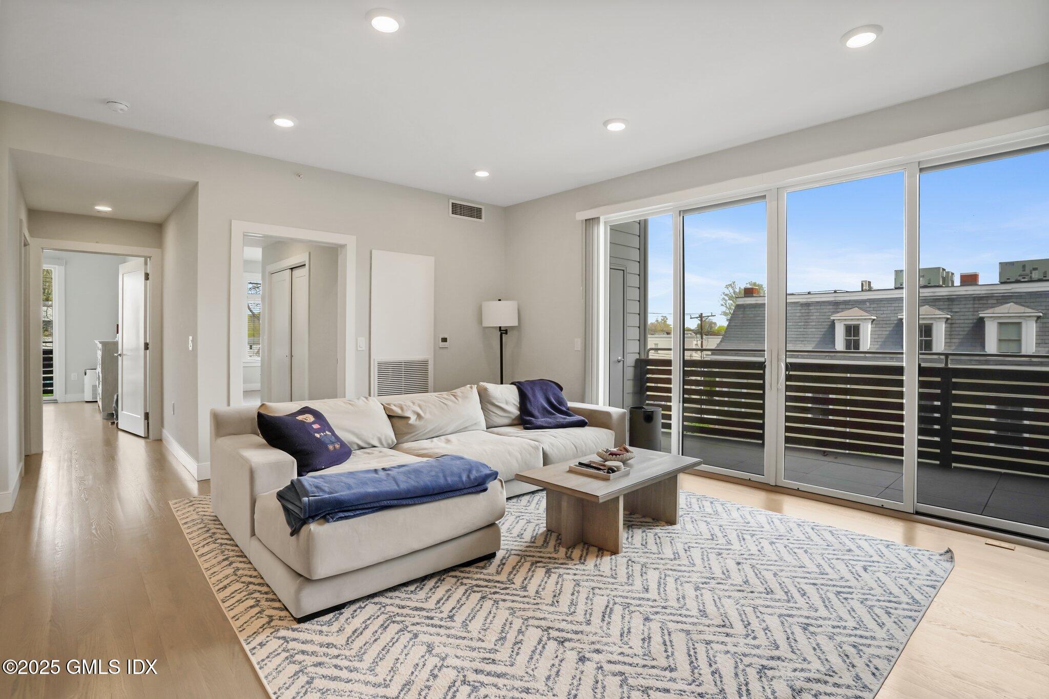 56 Old Field Point Road, Unit 1 Greenwich, CT 06830 - Photo 8 of 20 a living room with furniture