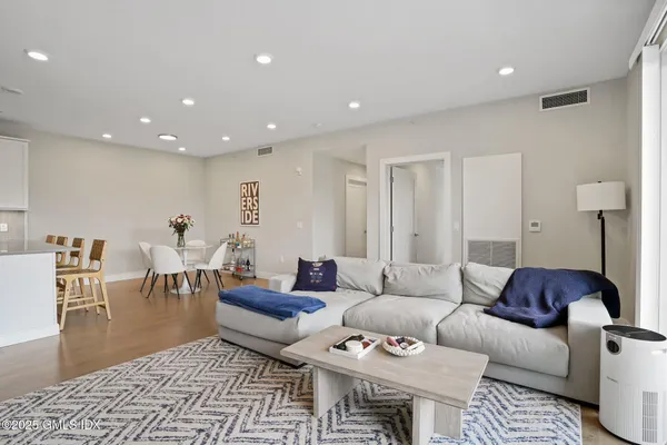 a living room with furniture and a rug