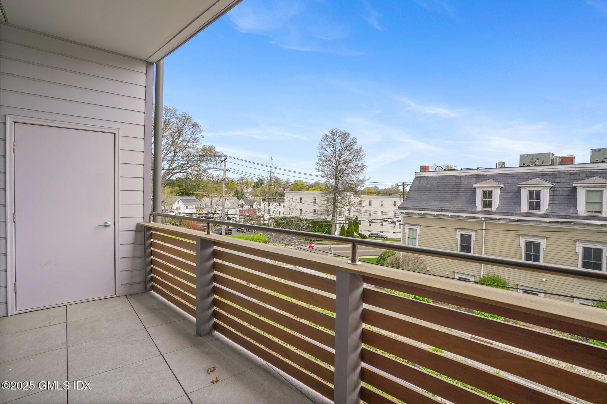 56 Old Field Point Road, Unit 1 Greenwich, CT 06830 - Photo 10 of 20 a view of a building from a balcony