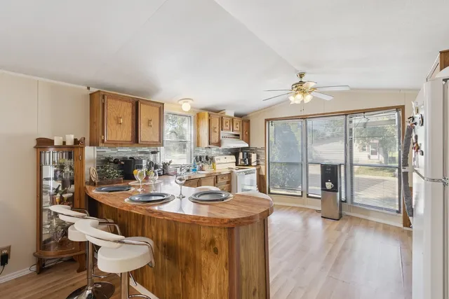 a view of a kitchen and dining room
