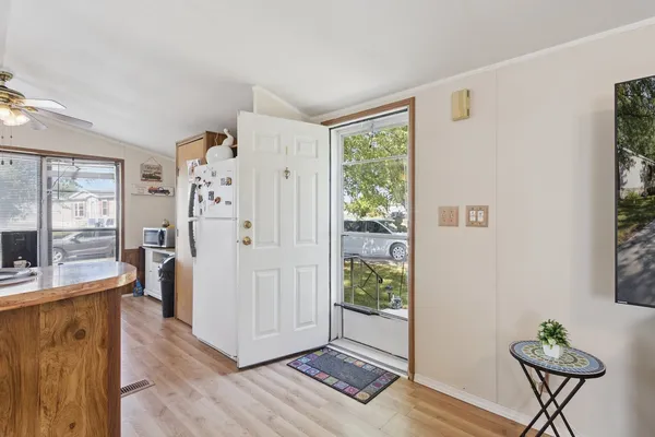 a view of a livingroom with furniture and a window