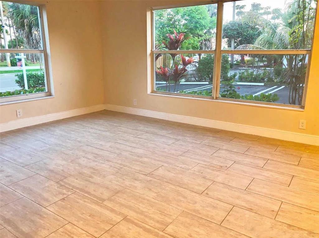 3502 Riverside Drive Coral Springs, FL 33065 - Photo 12 of 16 a view of a room with wooden floor and a window