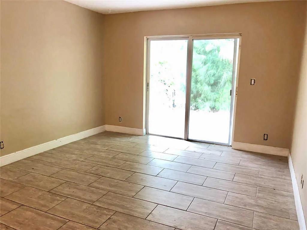 3502 Riverside Drive Coral Springs, FL 33065 - Photo 14 of 16 a view of an empty room and window