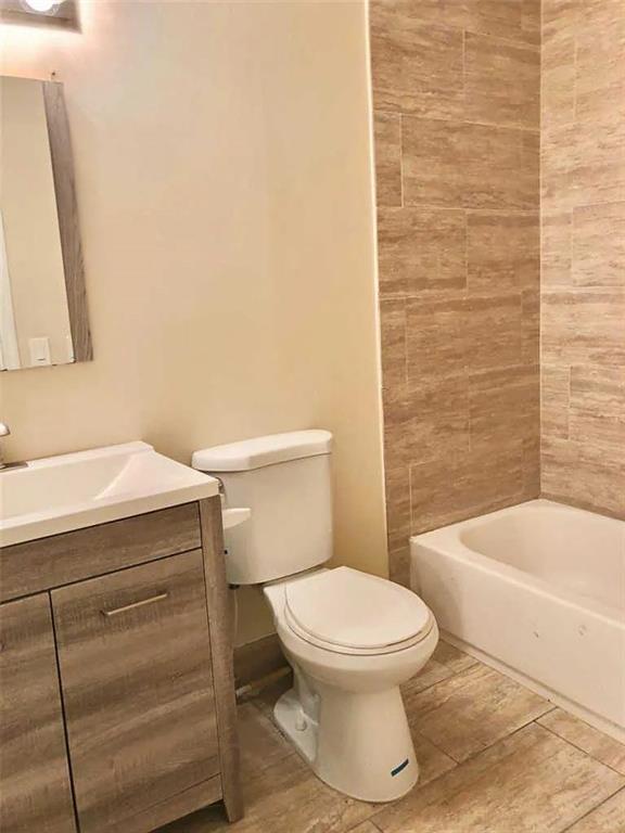 3502 Riverside Drive Coral Springs, FL 33065 - Photo 10 of 16 a bathroom with a toilet a sink and bathtub