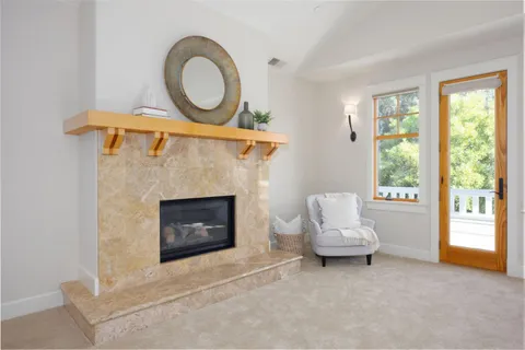a bath tub sitting in a bathroom next to a window