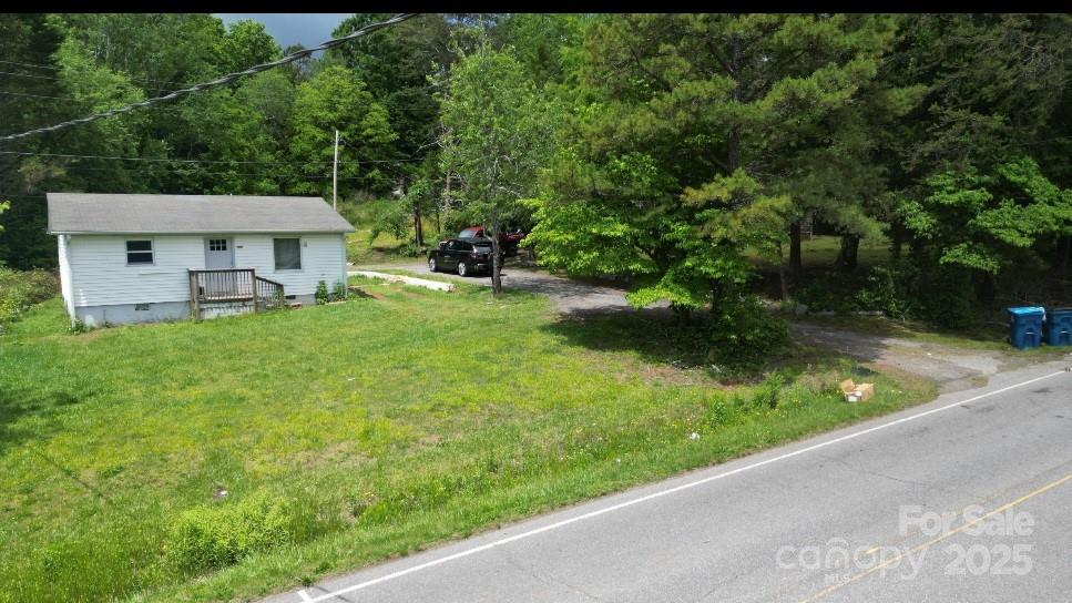 6649 Mountain Grove Road Hickory, NC 28602 - Photo 2 of 3 a view of a backyard with a garden and plants