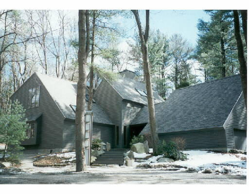 20 Beaver Pond Road Beverly, MA 01915 - Photo 1 of 1 a view of a house with a yard and garage