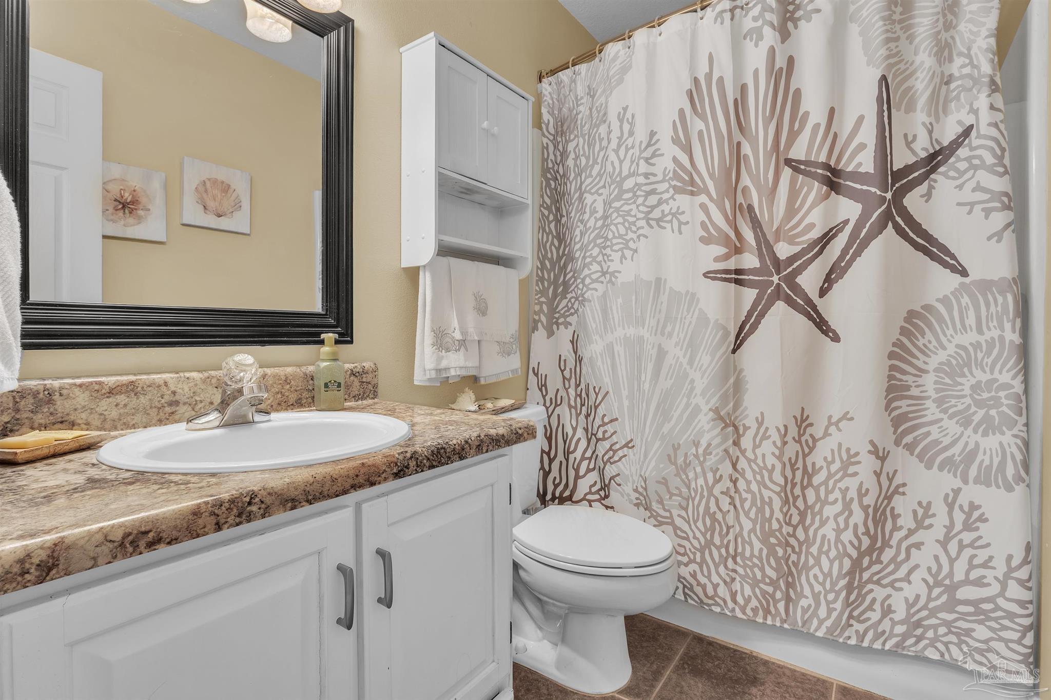 4321 Ridgeland Drive Pace, FL 32571 - Photo 21 of 36 a bathroom with a granite countertop sink and a mirror