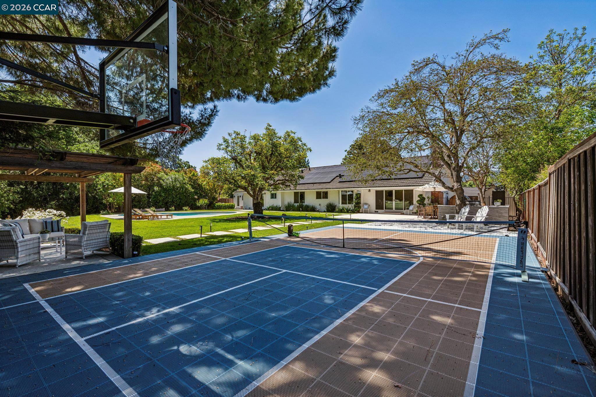 2941 Roundhill Road Alamo, CA 94507 - Photo 70 of 83 a view of a tennis ground with large trees